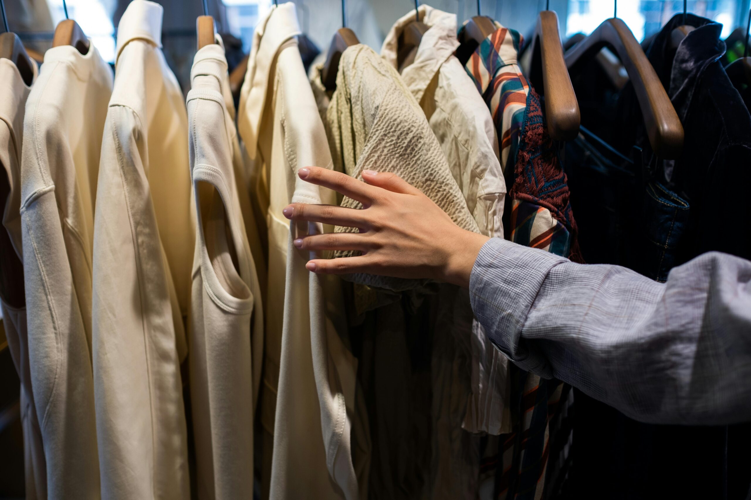 personal shopper in the shop choosing clothes
